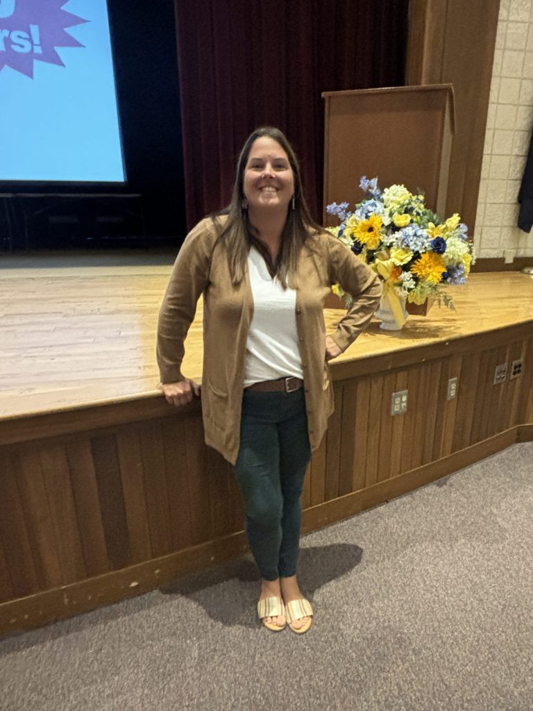 person presenting award.