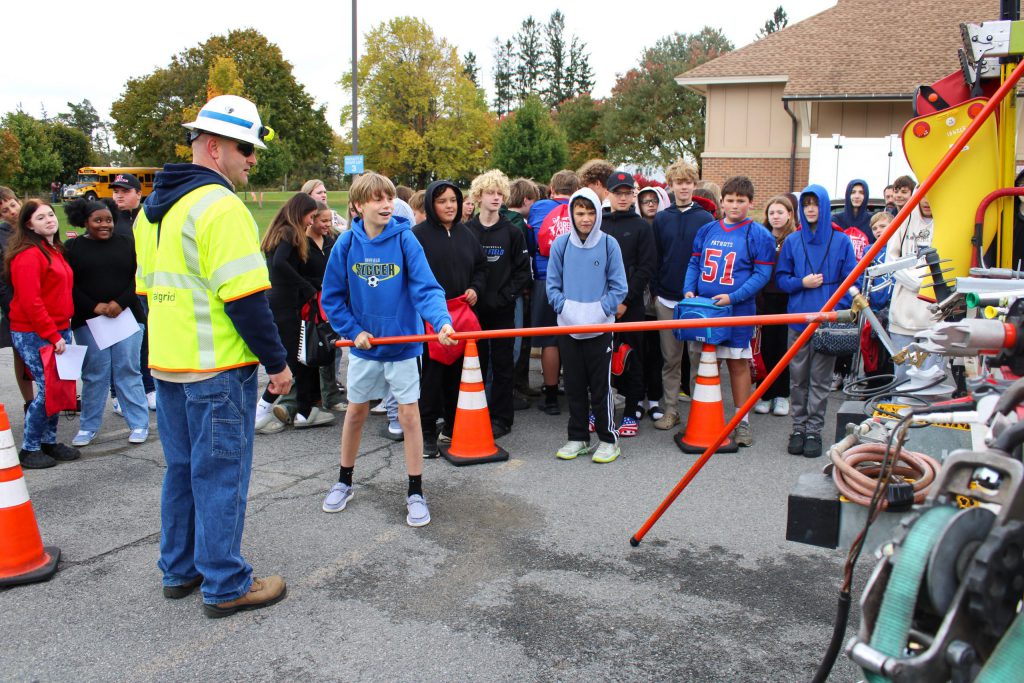 student interacting with a pole