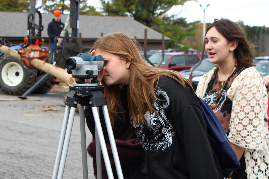 student looking through camera