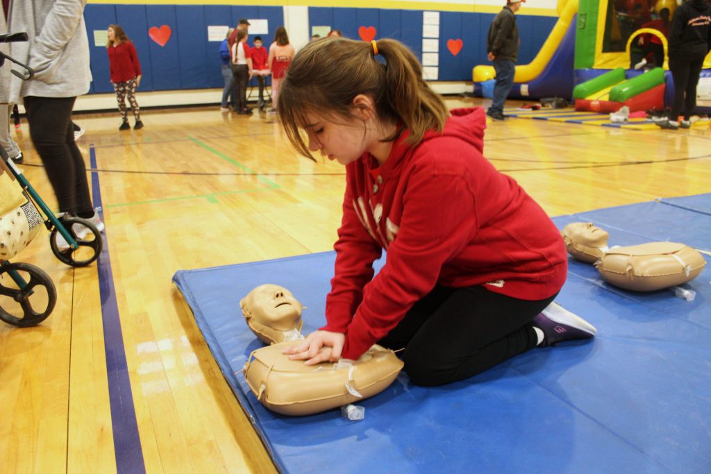 Photo of student preforming CPR