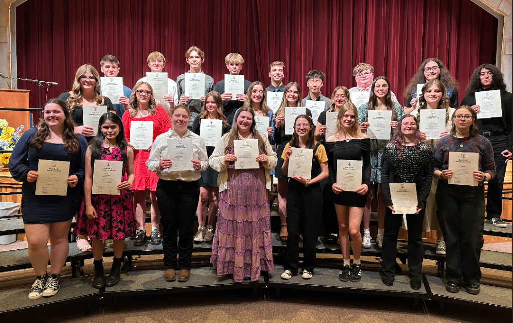 photo of students showing awards.