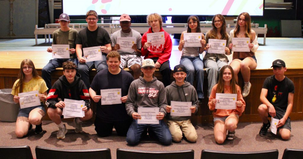 photo of students showing awards.