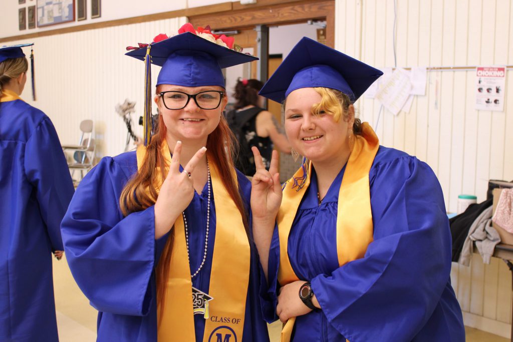 photo of two graduates together
