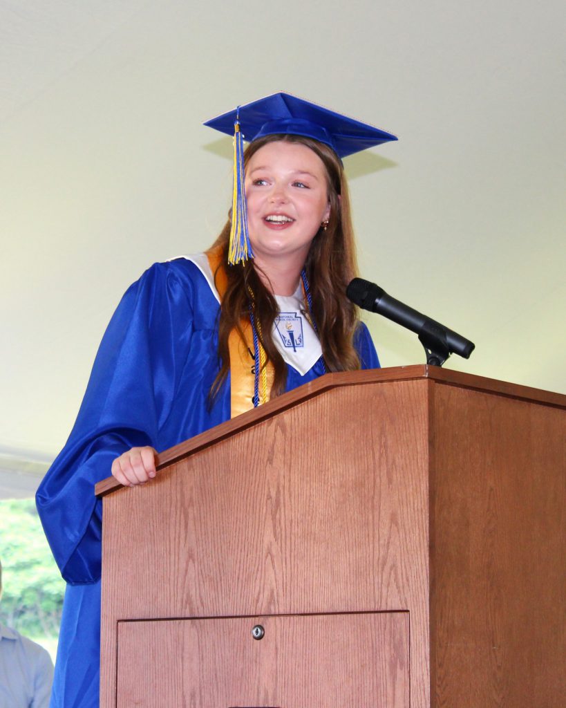 photo of graduate on podium