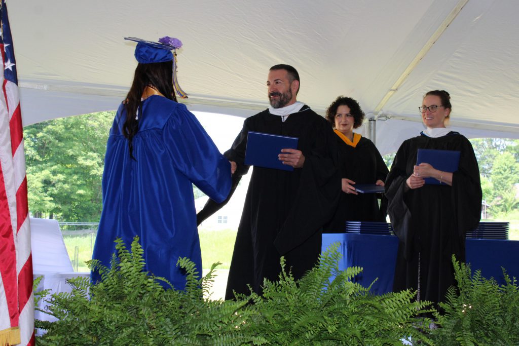 photo of graduate shaking hand