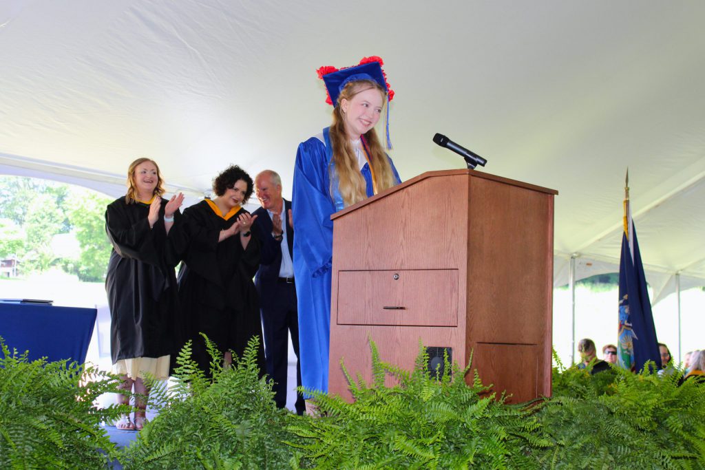 photo of graduate on podium