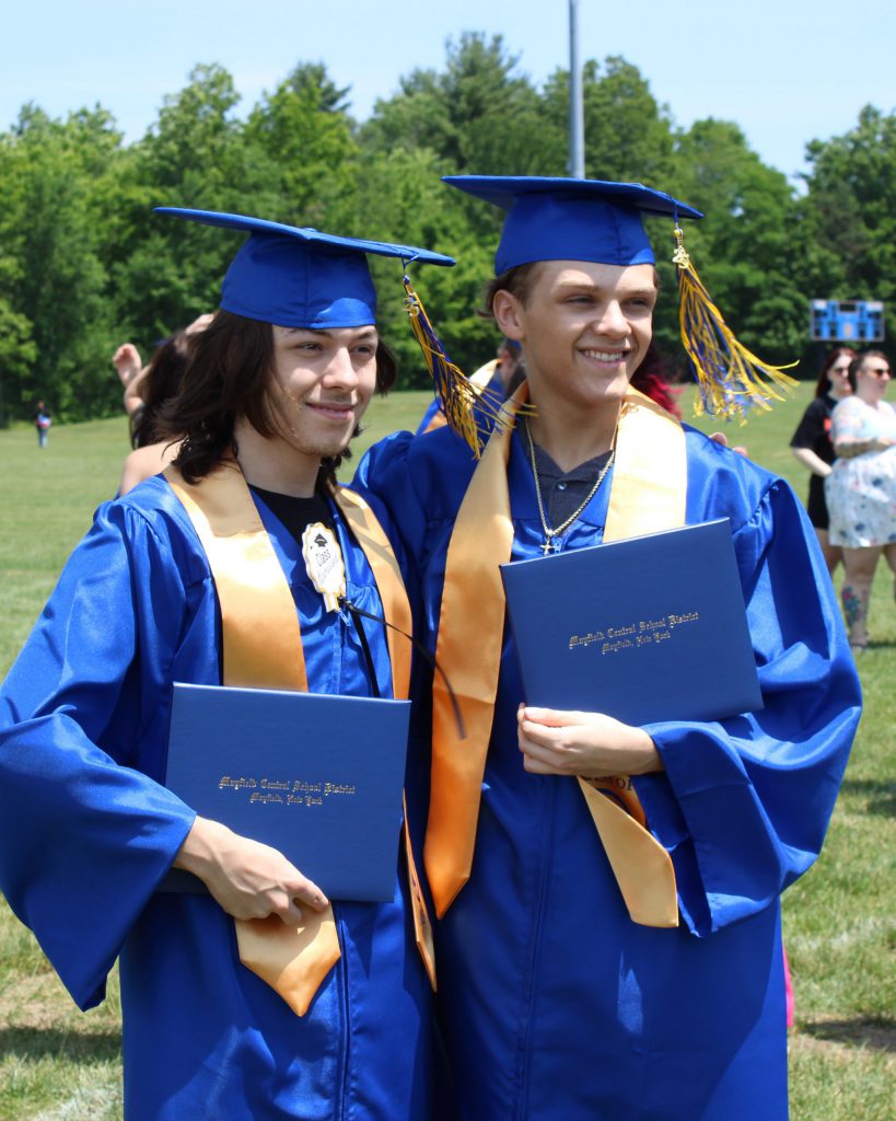 Photo of two graduates