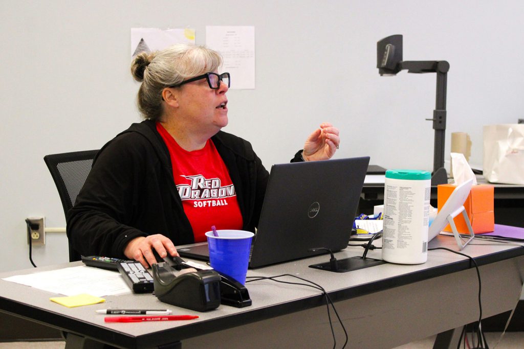 Teacher sitting at computer