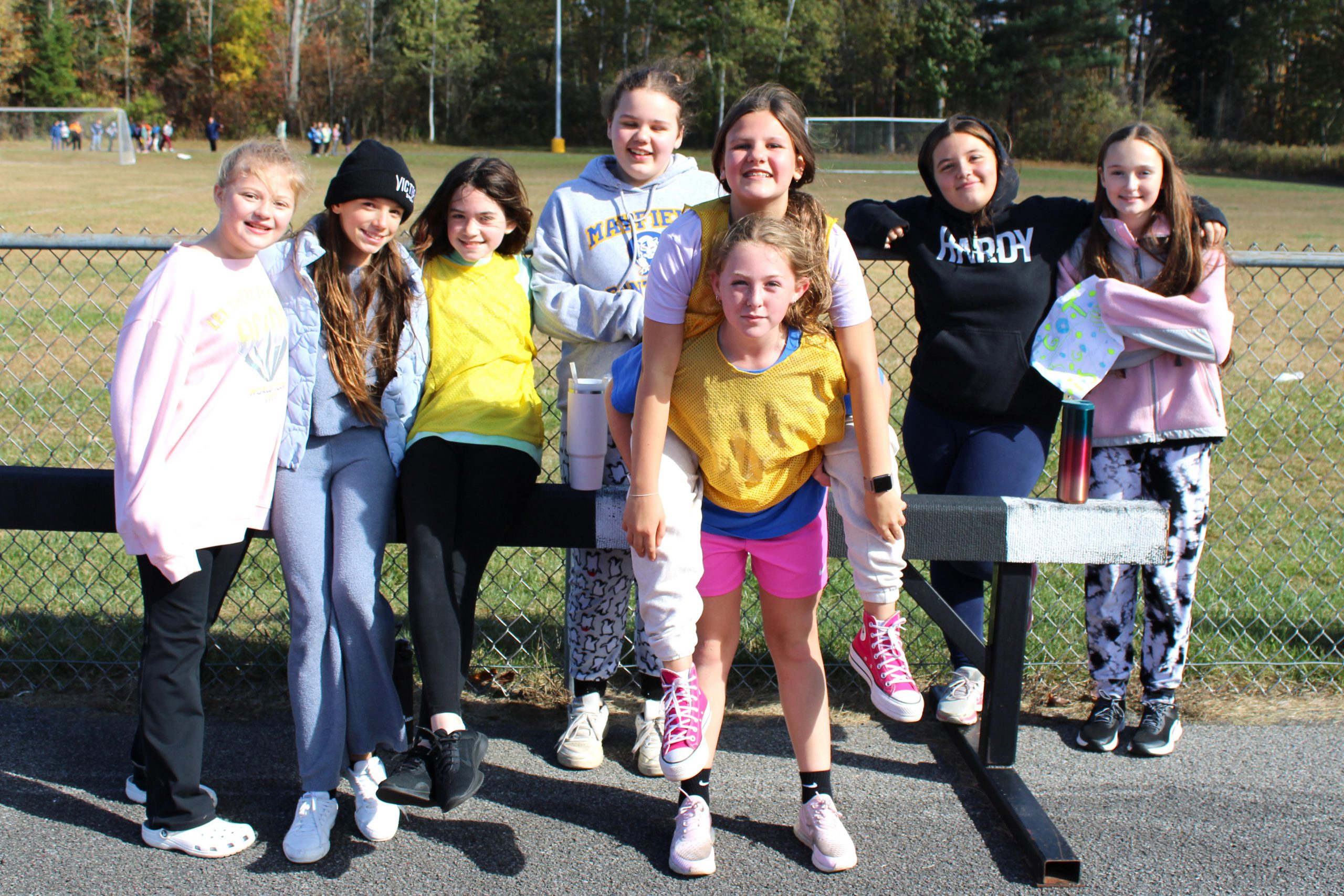 eight students pose outside